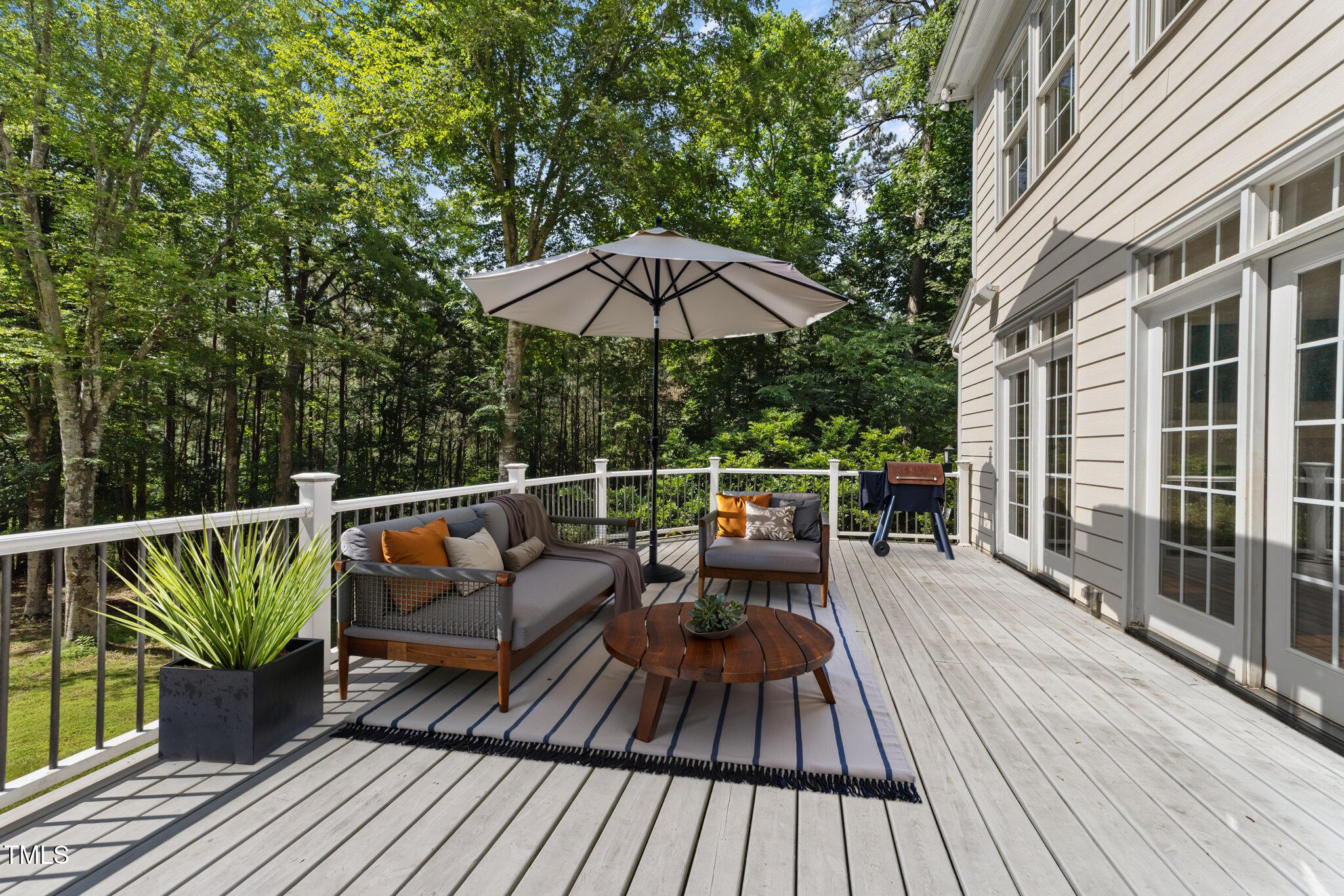 7000 Millstone Ridge Court Raleigh, NC 27614 - Photo 53 of 70 a view of balcony with outdoor seating and wooden floor