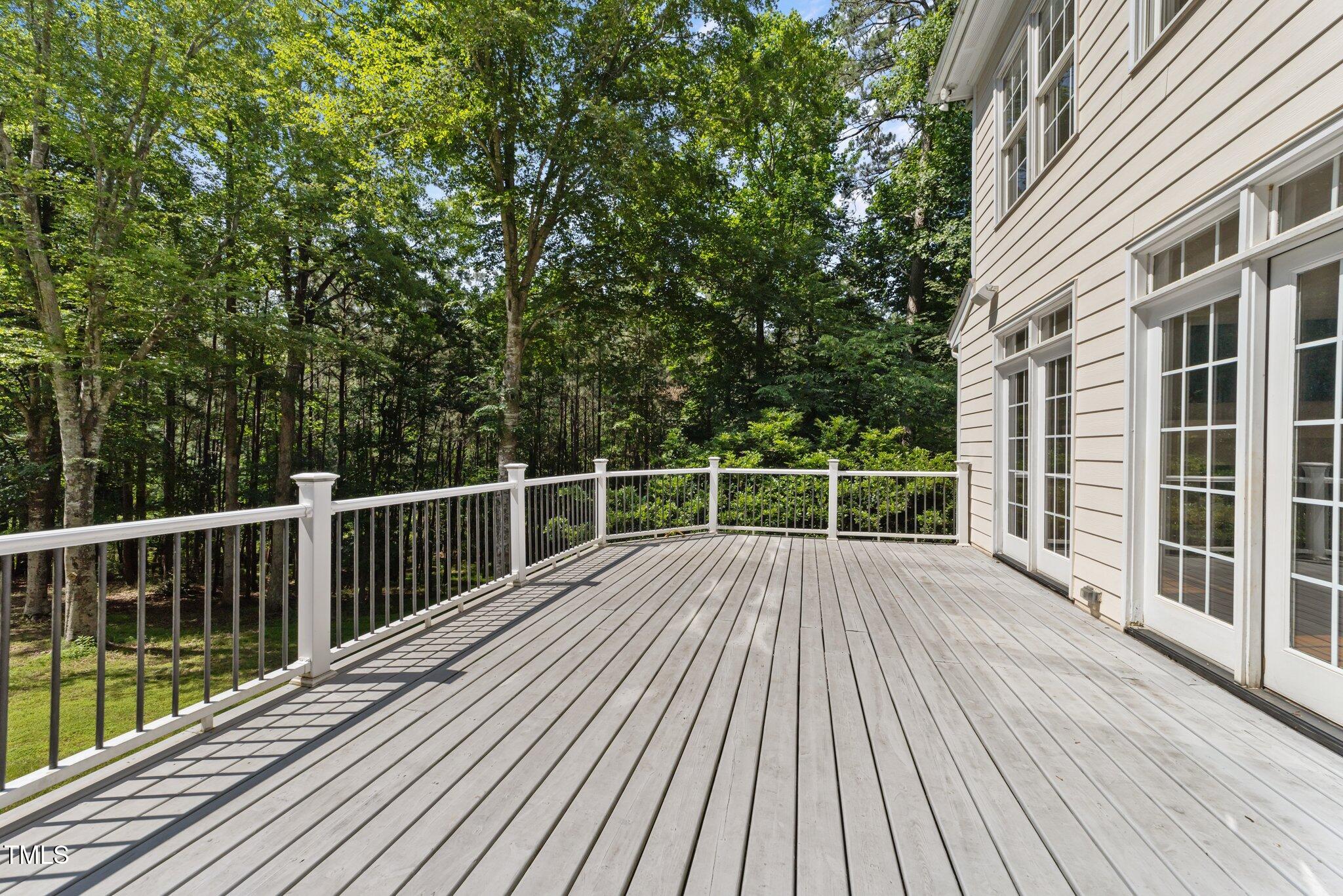 7000 Millstone Ridge Court Raleigh, NC 27614 - Photo 54 of 70 a view of a wooden deck with a yard