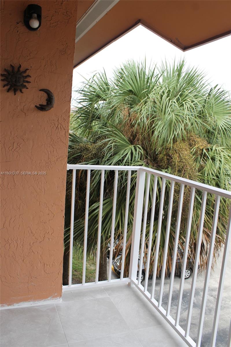 7135 Northwest 179th Street, Unit 302 Hialeah, FL 33015 - Photo 4 of 6 a view of outdoor space with deck