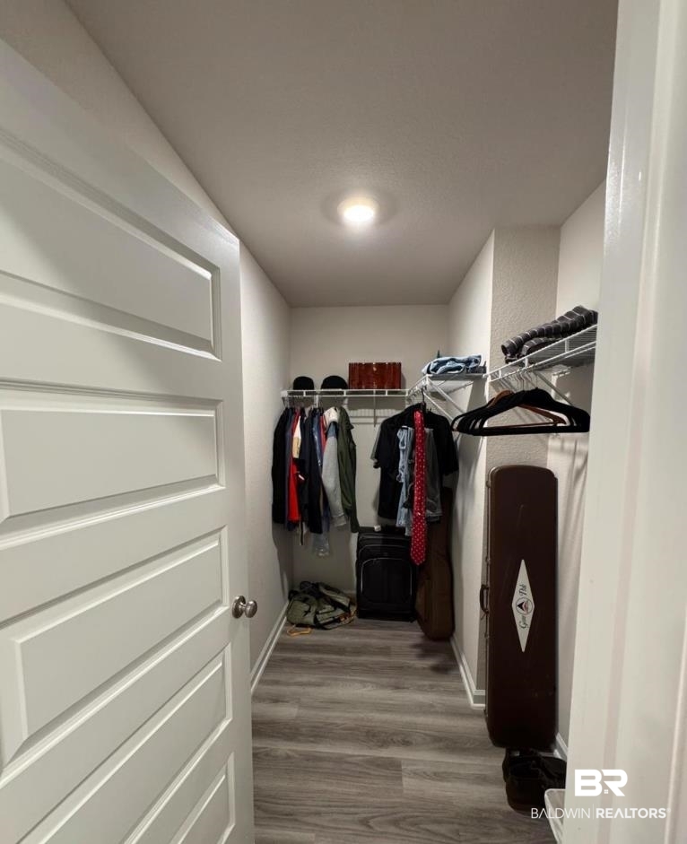 23933 Signor Place Daphne, AL 36526 - Photo 19 of 24 Spacious closet featuring wood finished floors