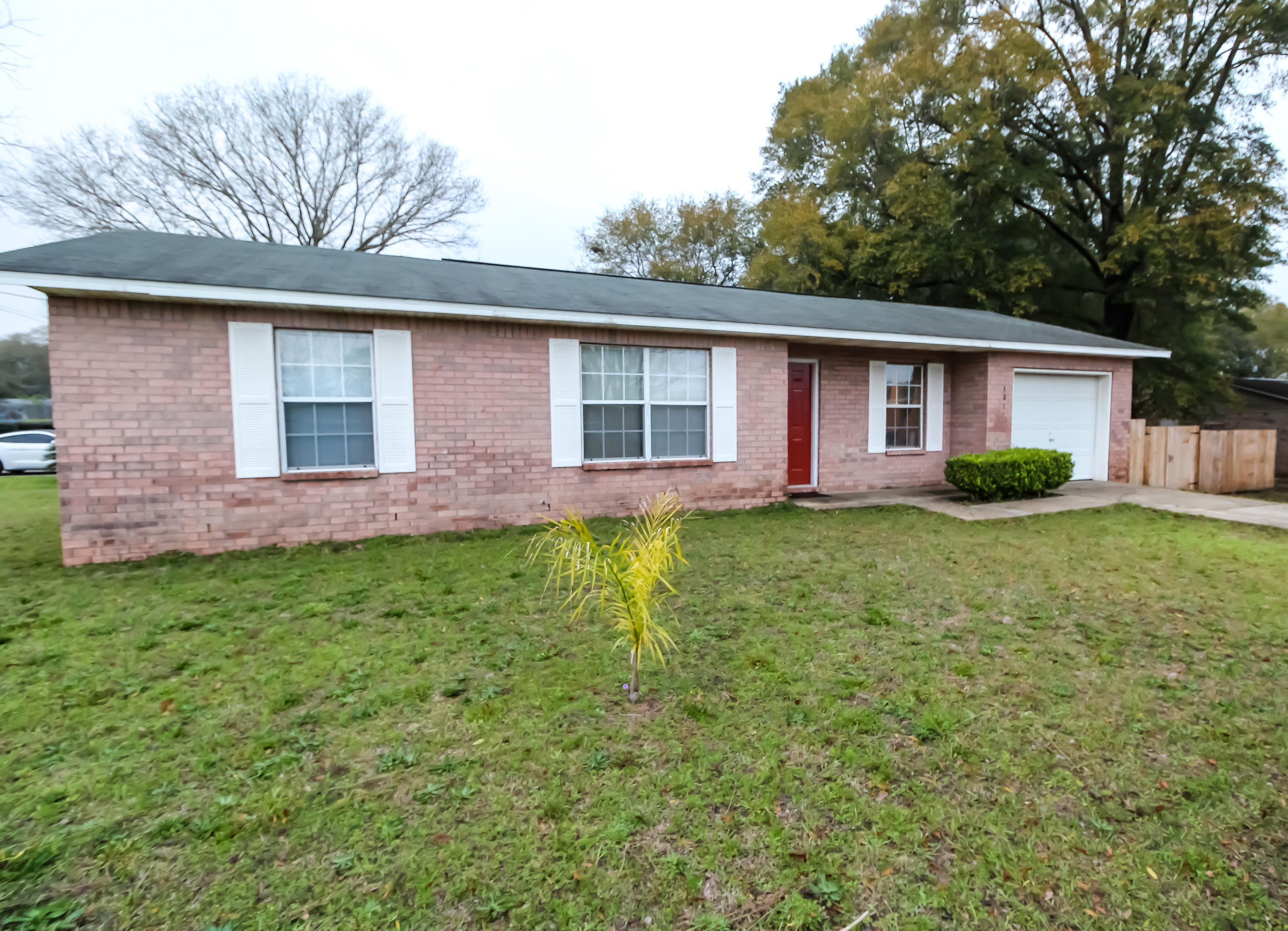 501 Anderson Street Crestview, FL 32536 - Photo 1 of 10 a front view of house with yard and green space