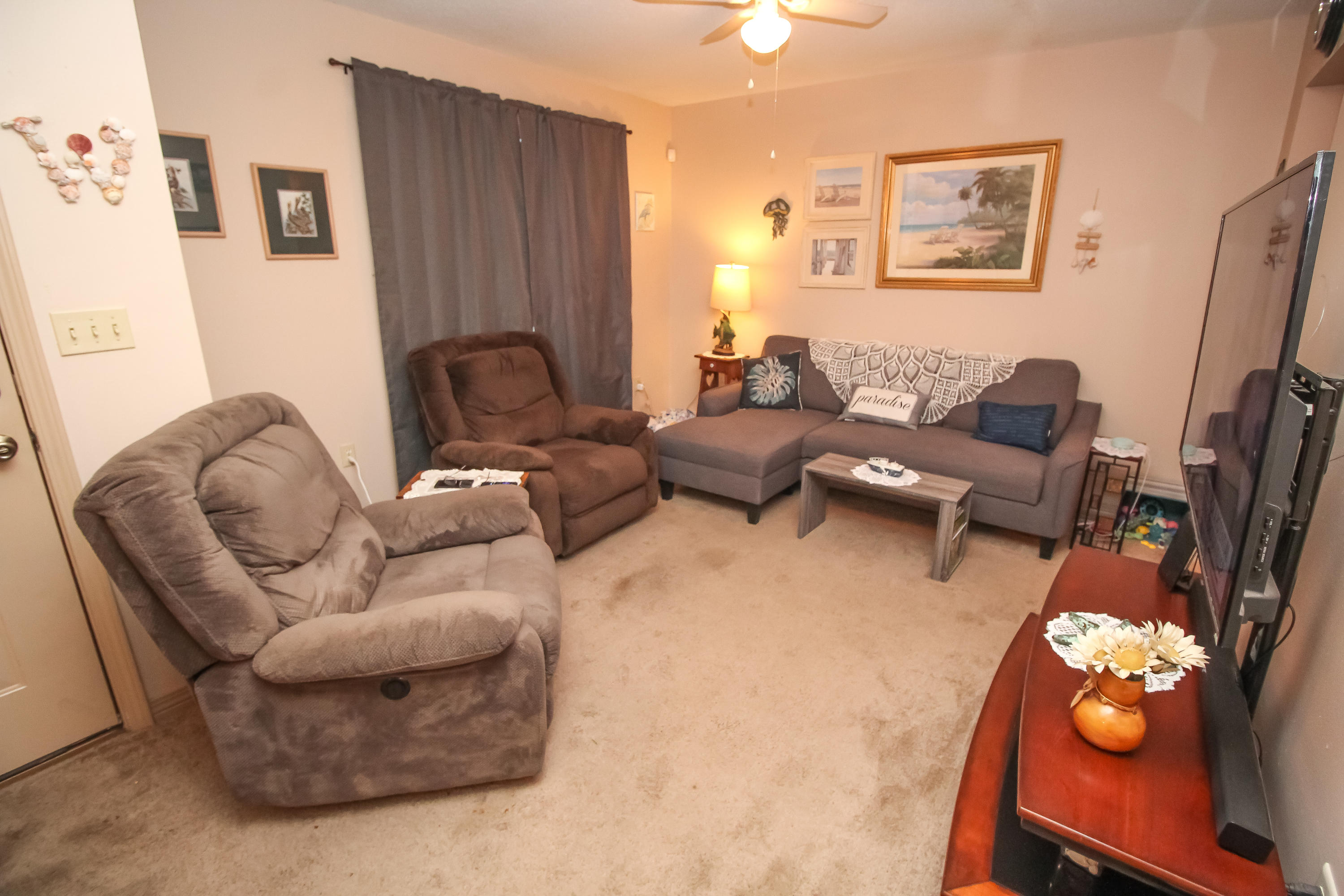 501 Anderson Street Crestview, FL 32536 - Photo 3 of 10 a living room with furniture and a flat screen tv