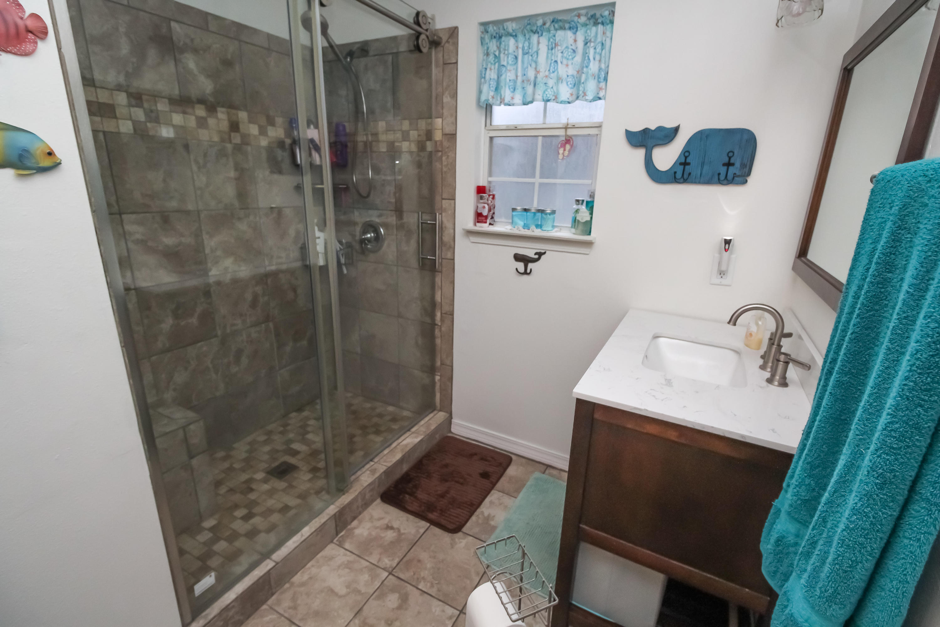 501 Anderson Street Crestview, FL 32536 - Photo 6 of 10 a bathroom with a sink and shower