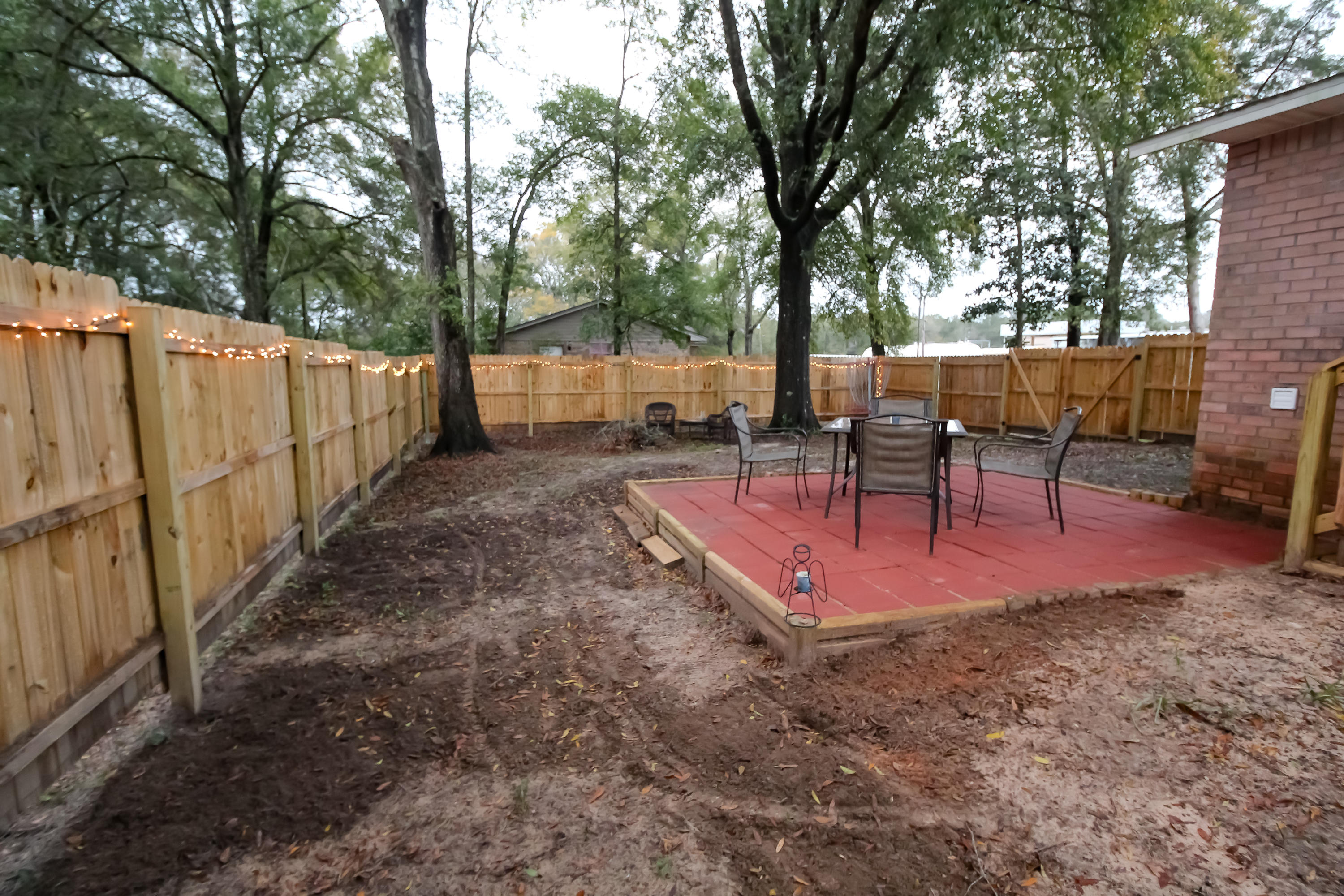 501 Anderson Street Crestview, FL 32536 - Photo 9 of 10 a view of a backyard with sitting area