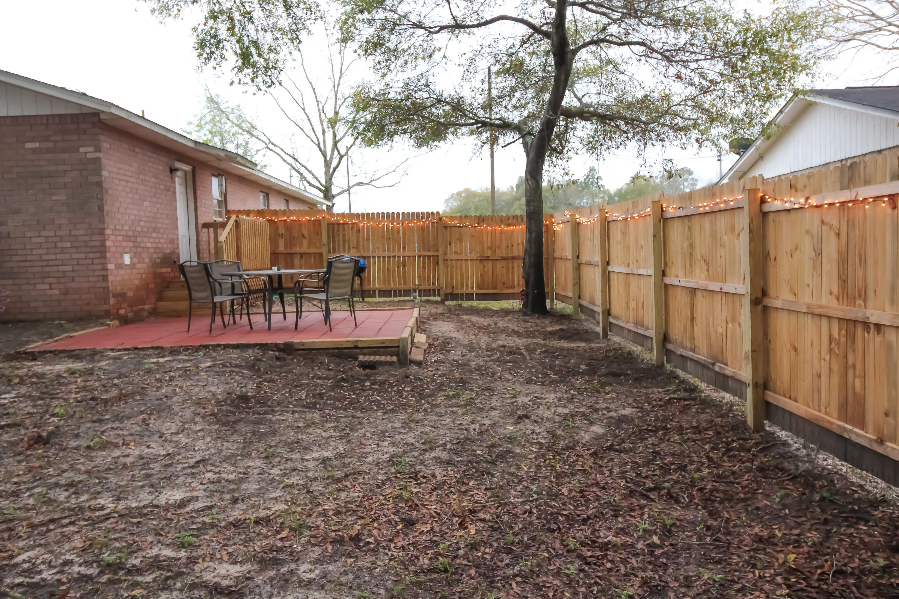 501 Anderson Street Crestview, FL 32536 - Photo 10 of 10 a view of a backyard with wooden fence