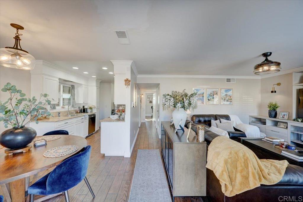 10321 Santana Ranch Drive Santee, CA 92071 - Photo 2 of 28 a living room with furniture and a chandelier