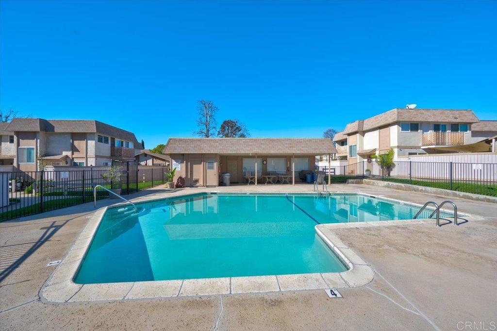 10321 Santana Ranch Drive Santee, CA 92071 - Photo 27 of 28 a front view of a house with a yard table and chairs
