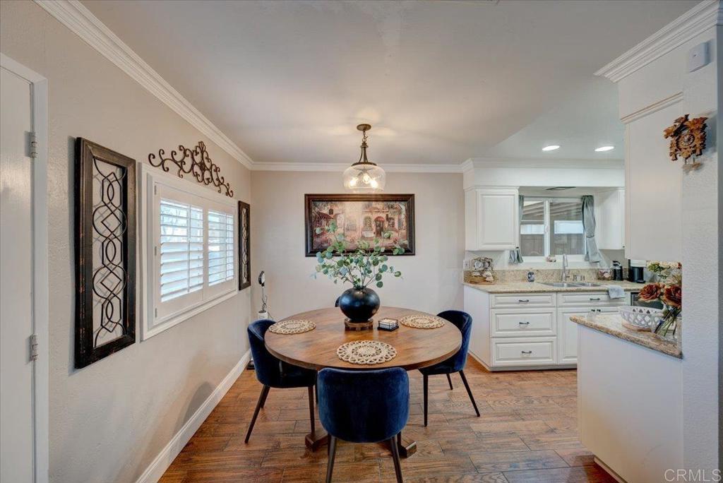 10321 Santana Ranch Drive Santee, CA 92071 - Photo 3 of 28 a view of a dining room with furniture window and wooden floor
