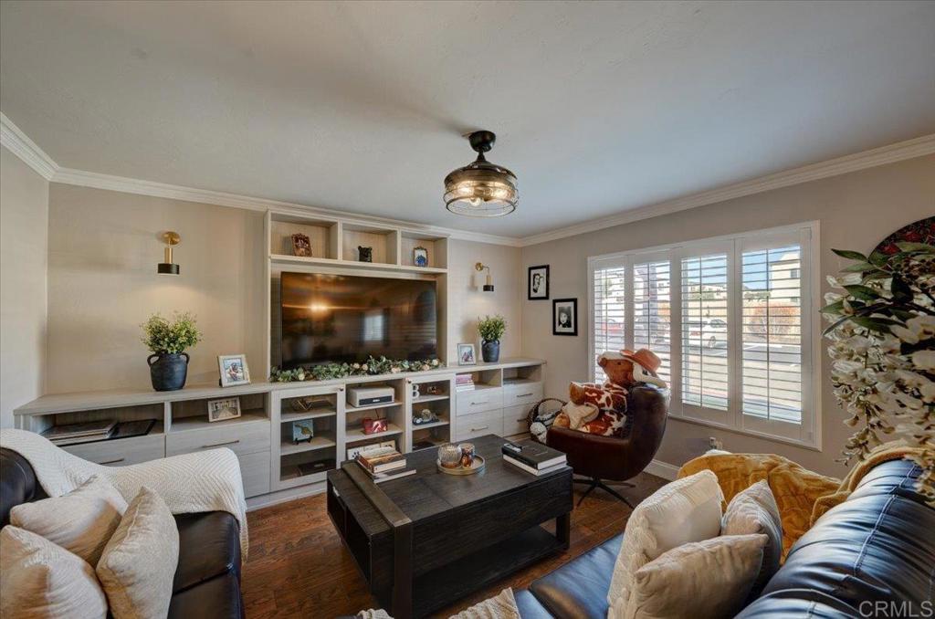 10321 Santana Ranch Drive Santee, CA 92071 - Photo 5 of 28 a living room with furniture and a flat screen tv