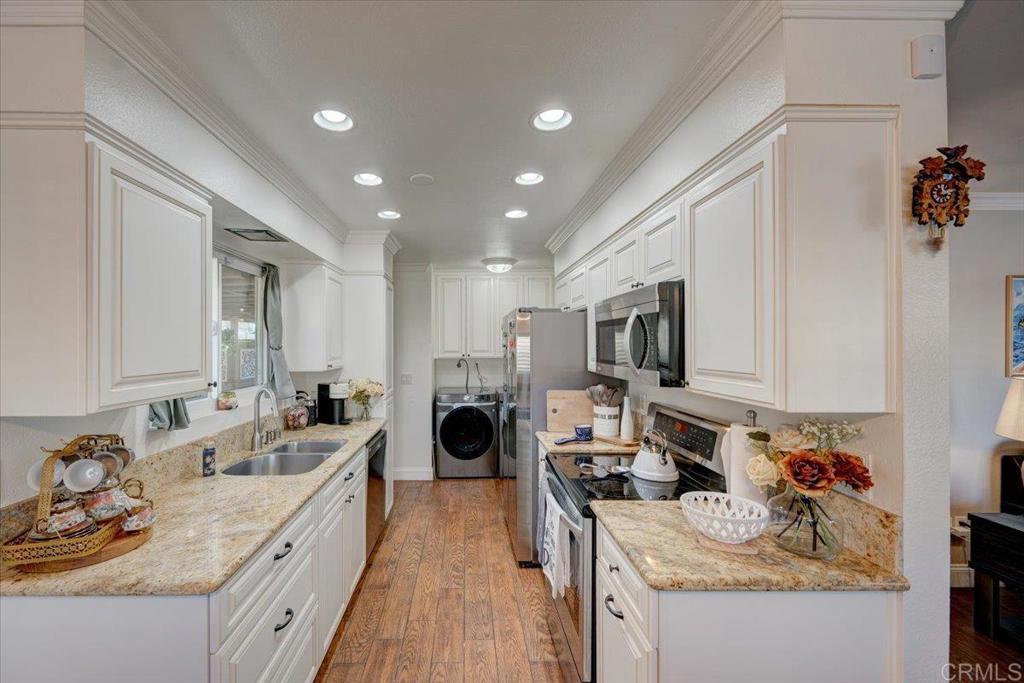 10321 Santana Ranch Drive Santee, CA 92071 - Photo 8 of 28 a kitchen with a sink stove and refrigerator