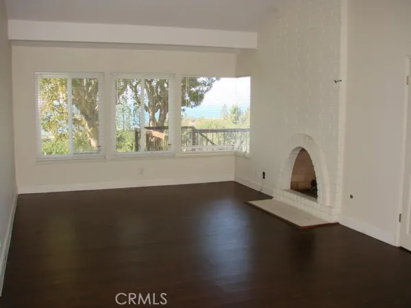 a view of a balcony with wooden floor