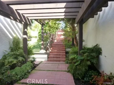 a porch with seating space and garden