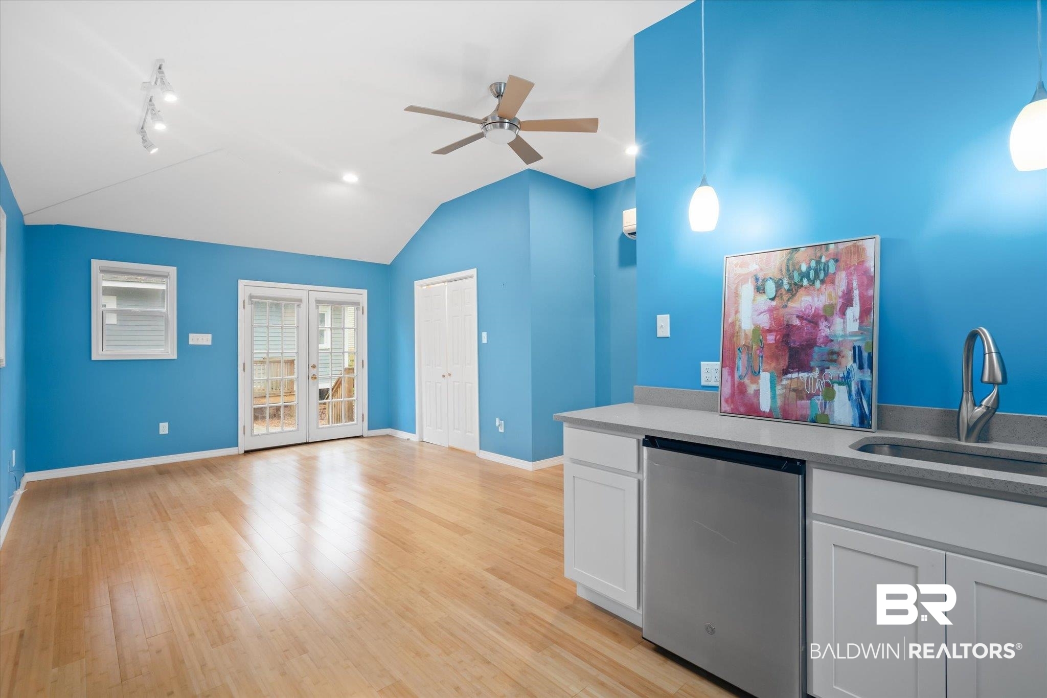 14 South Monterey Street Mobile, AL 36604 - Photo 22 of 41 Kitchen with light wood-type flooring, pendant lighting, sink, white cabinets, and ceiling fan