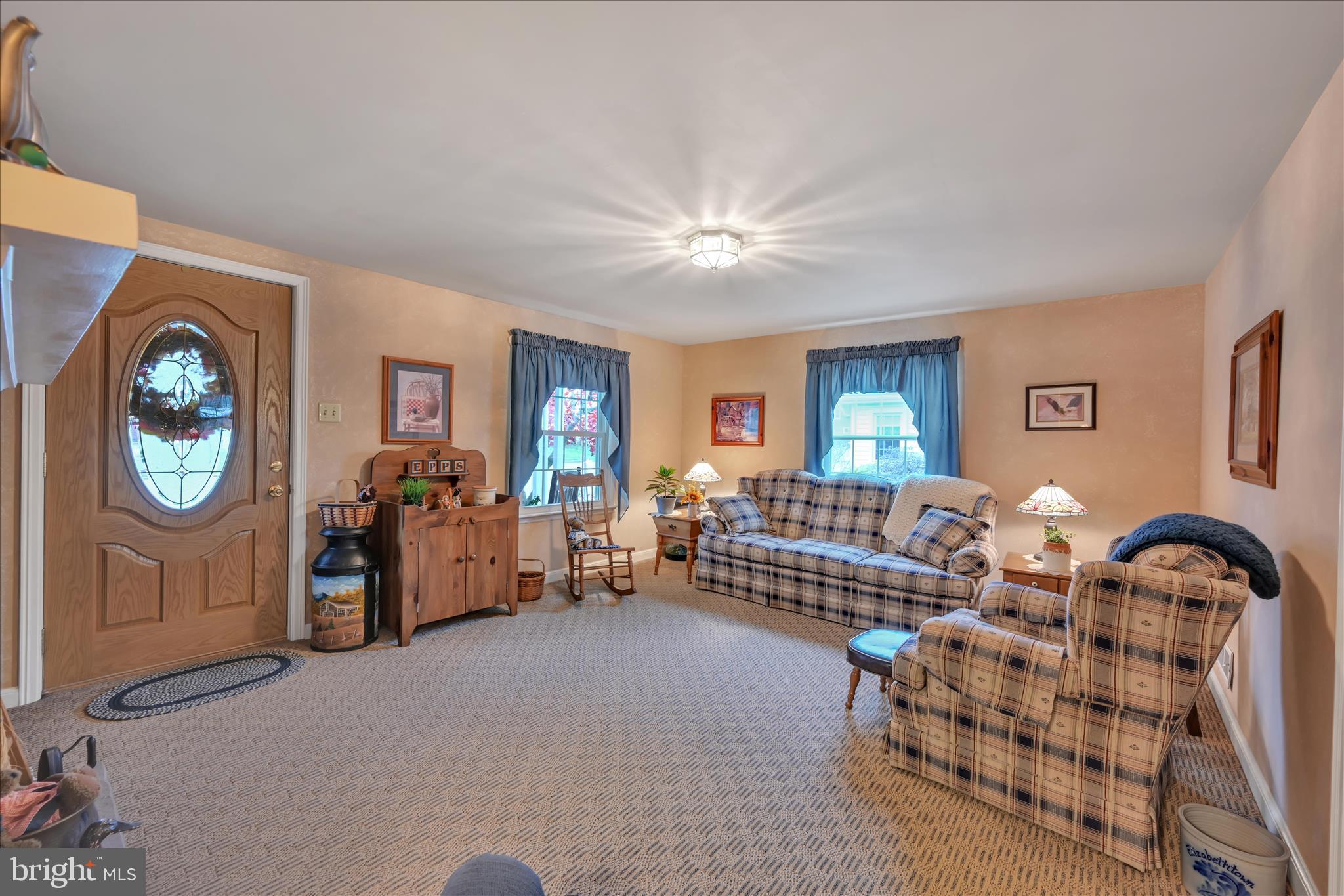 223 Lemon Street Elizabethtown, PA 17022 - Photo 11 of 31 a living room with furniture a clock on wall and a window
