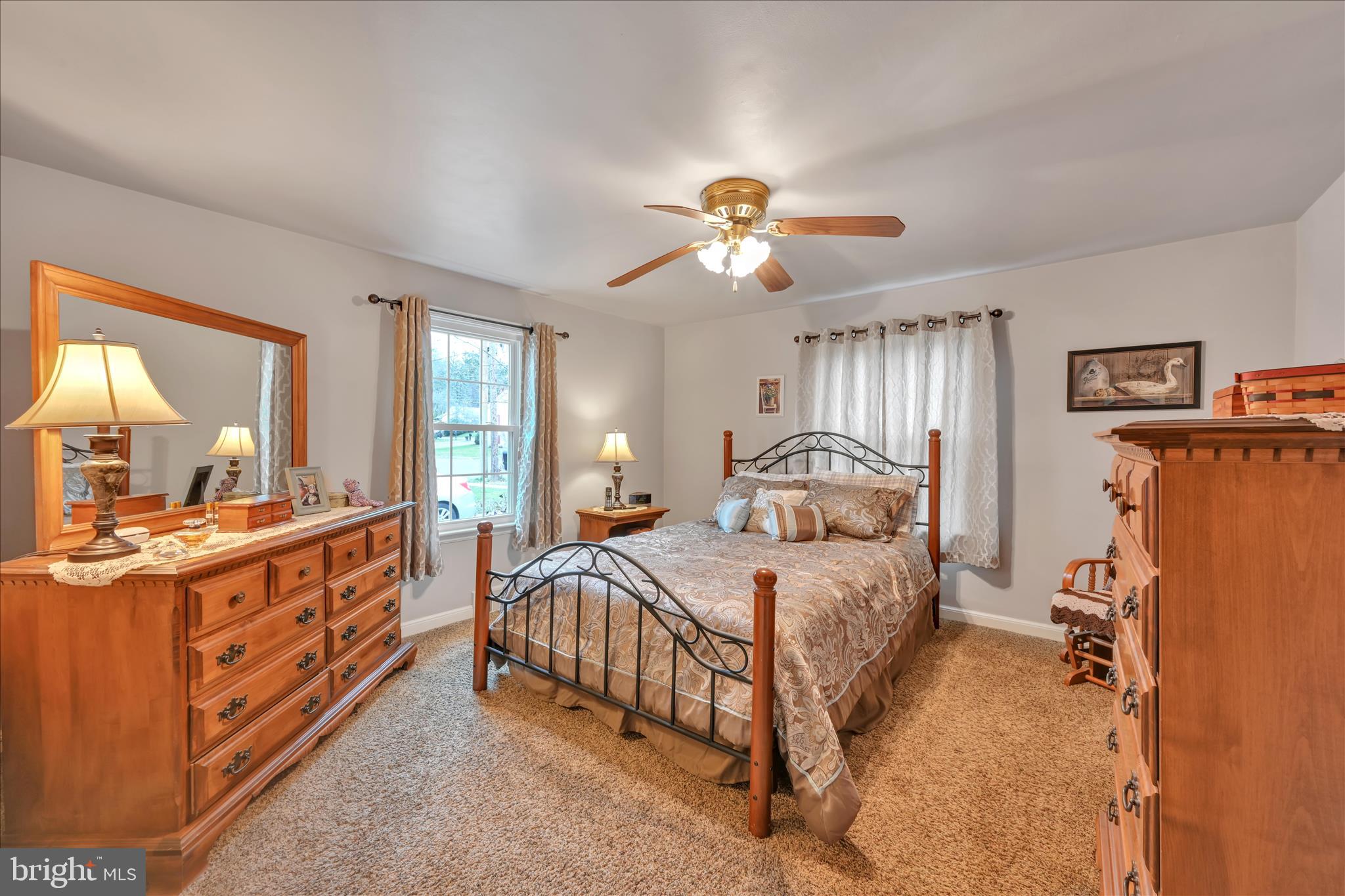 223 Lemon Street Elizabethtown, PA 17022 - Photo 20 of 31 a bedroom with a bed and a chandelier