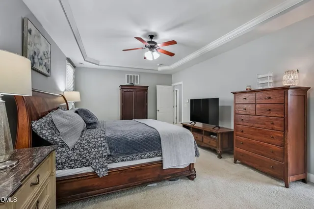 a bedroom with a bed and furniture