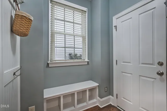 a room that has a window and a wooden floor