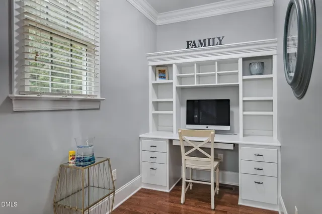 a workspace with furniture and a window