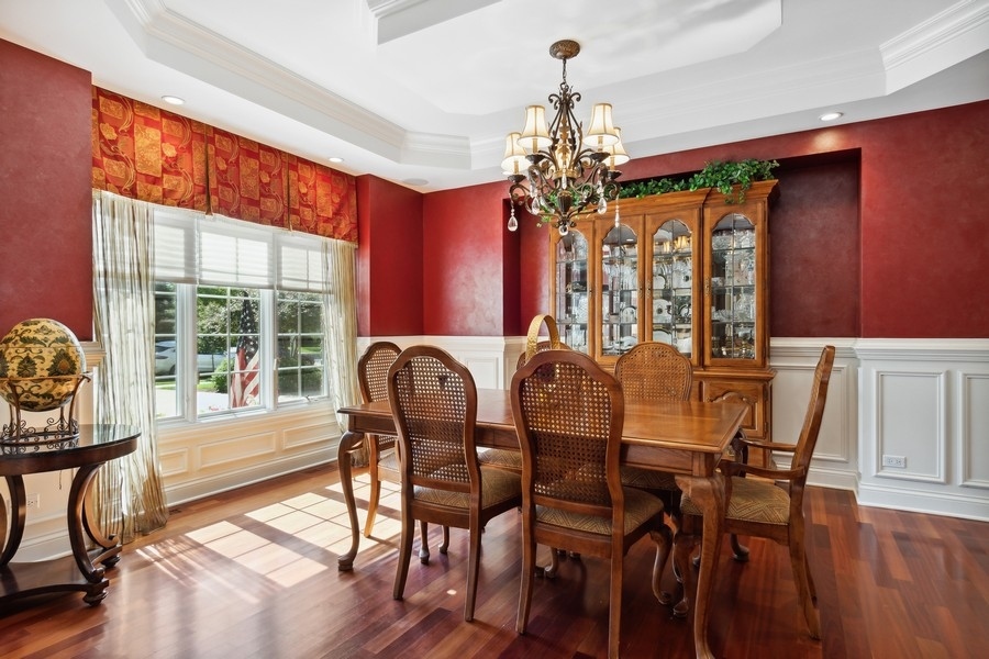 4050 Douglas Road Downers Grove, IL 60515 - Photo 13 of 60 a view of a dining room with furniture window and wooden floor