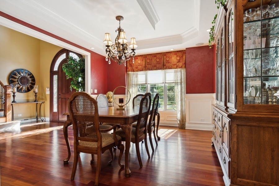 4050 Douglas Road Downers Grove, IL 60515 - Photo 14 of 60 a view of a dining room with furniture window and wooden floor