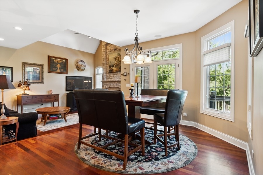 4050 Douglas Road Downers Grove, IL 60515 - Photo 20 of 60 a view of a dining room with furniture window and wooden floor
