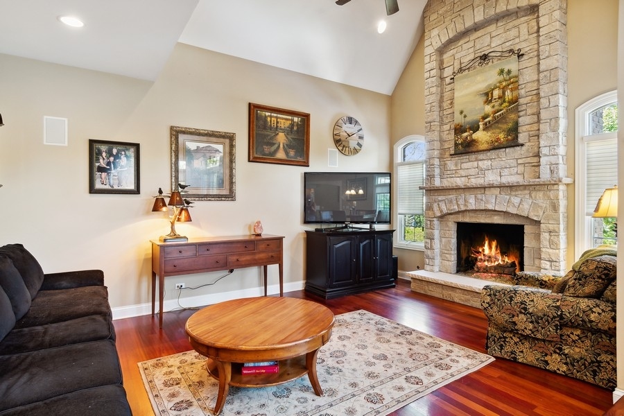 4050 Douglas Road Downers Grove, IL 60515 - Photo 24 of 60 a living room with furniture and a fireplace