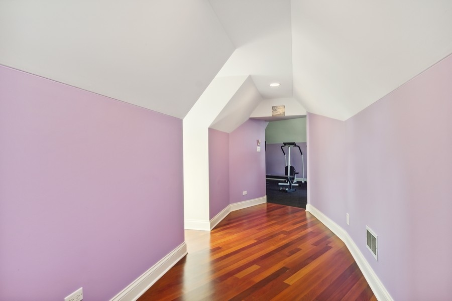 4050 Douglas Road Downers Grove, IL 60515 - Photo 36 of 60 a bedroom with a bed and a chandelier