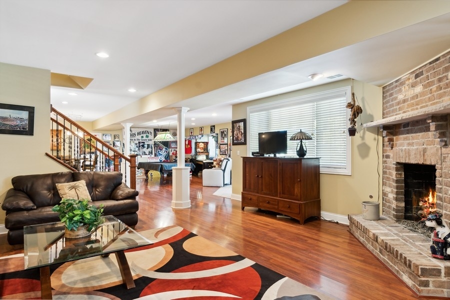 4050 Douglas Road Downers Grove, IL 60515 - Photo 41 of 60 a living room with furniture and a flat screen tv
