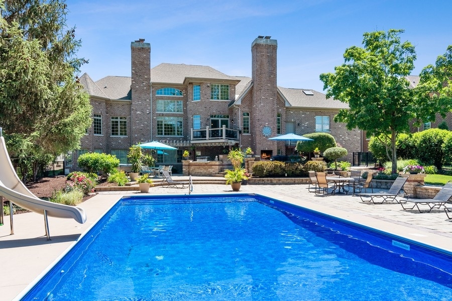4050 Douglas Road Downers Grove, IL 60515 - Photo 47 of 60 a view of a house with swimming pool and sitting area