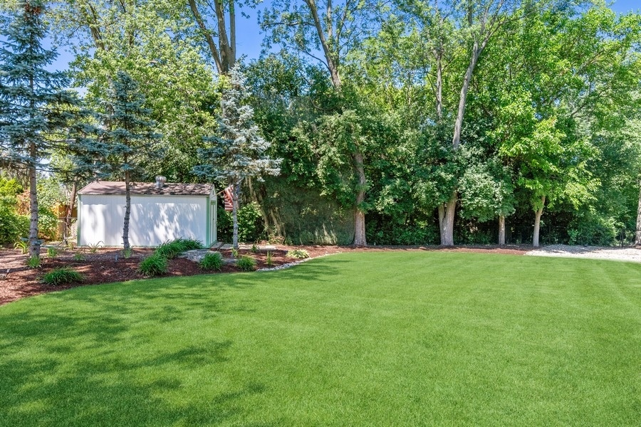 4050 Douglas Road Downers Grove, IL 60515 - Photo 56 of 60 a view of a house with backyard and sitting area