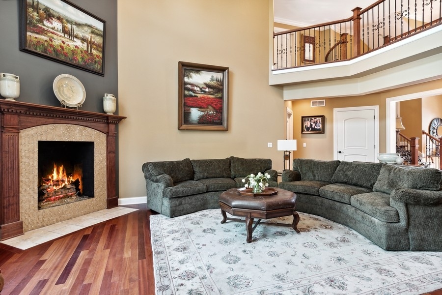 4050 Douglas Road Downers Grove, IL 60515 - Photo 9 of 60 a living room with furniture and a fireplace