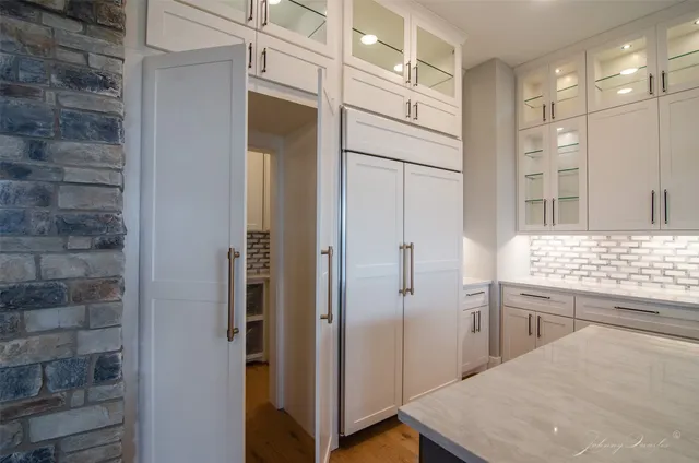 a bathroom with a shower and a sink