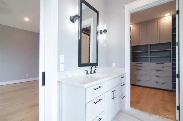 a bathroom with a sink and a mirror