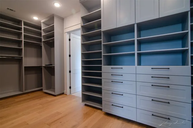a view of an empty walk in closet