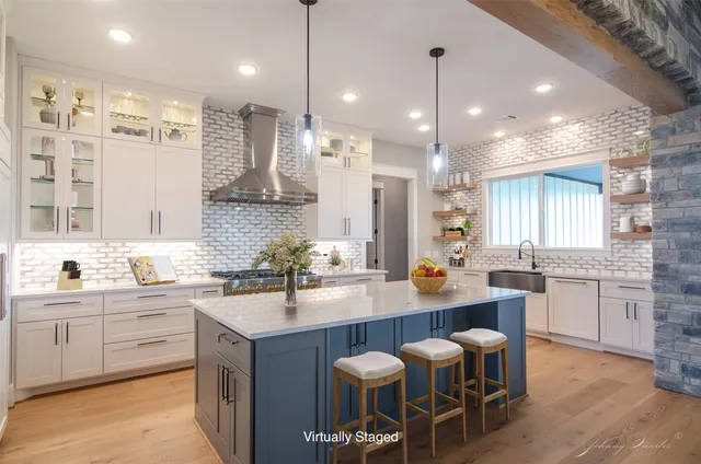 a kitchen with a sink and stove
