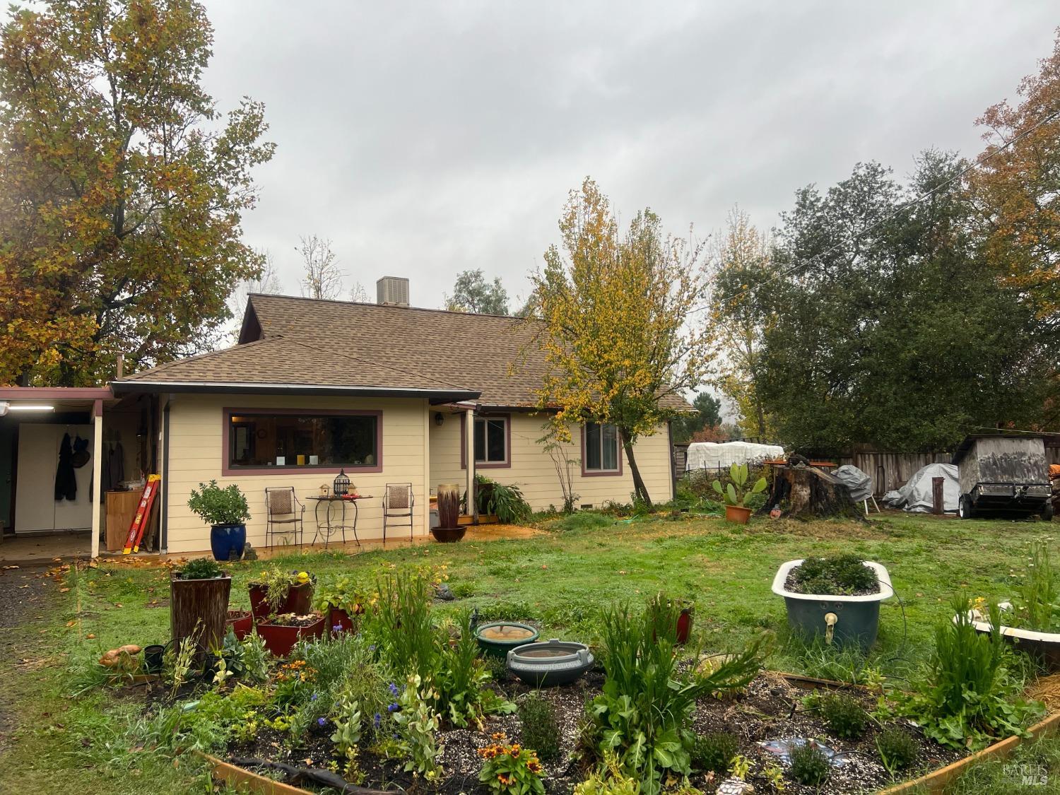 a front view of a house with garden
