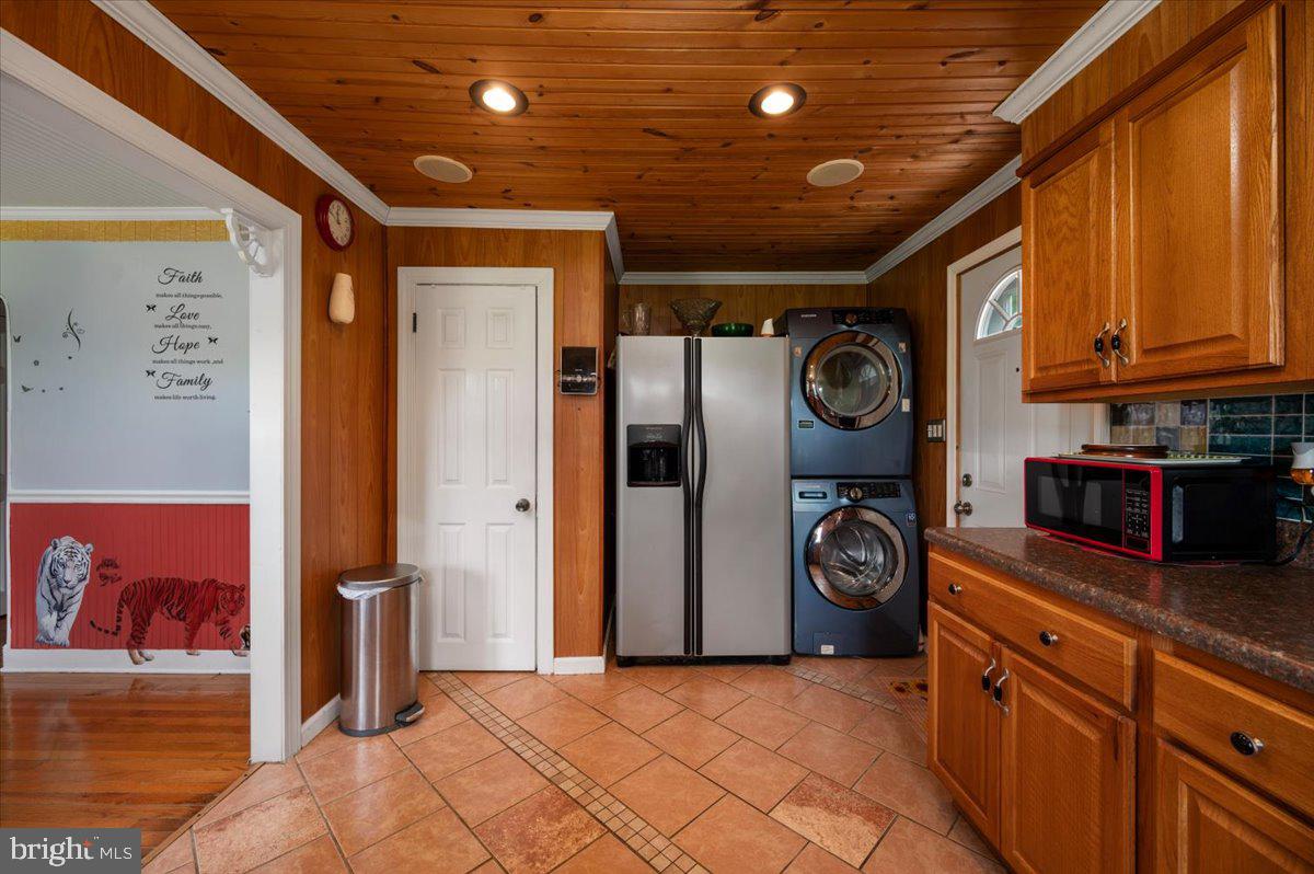 141 Raintree Lane Reedville, VA 22539 - Photo 67 of 86 Charming laundry nook with wood accents.