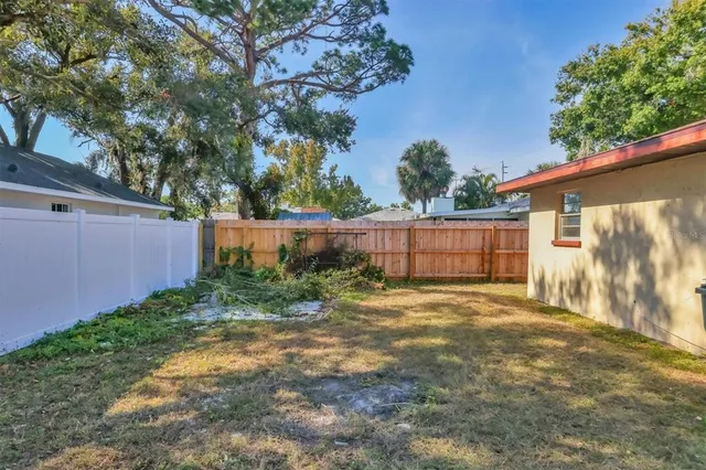 a backyard of a house with lots of green space