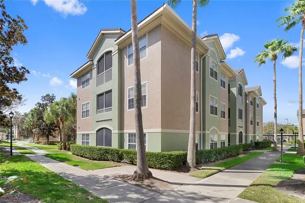 a front view of a building with a garden