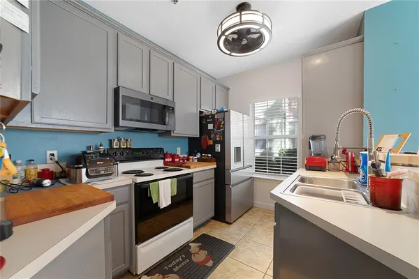 a kitchen with a stove and a sink