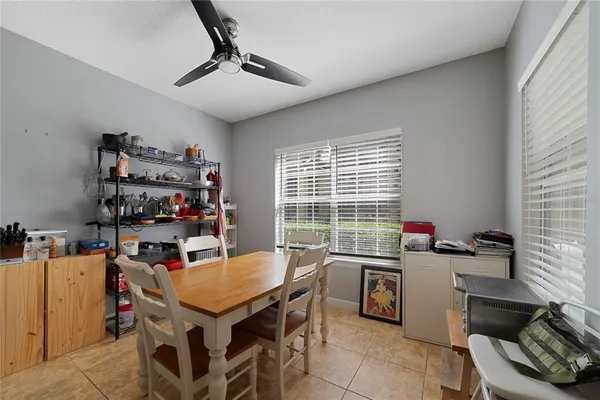 a view of a dining room with furniture and a window