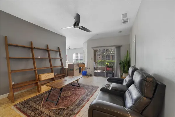 a living room with furniture and a window
