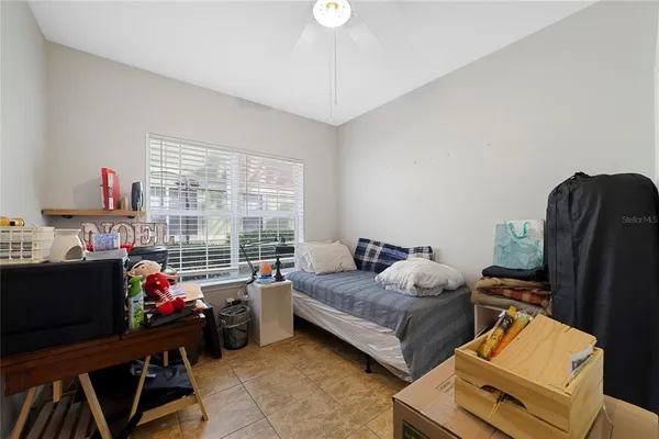a bedroom with furniture and a window