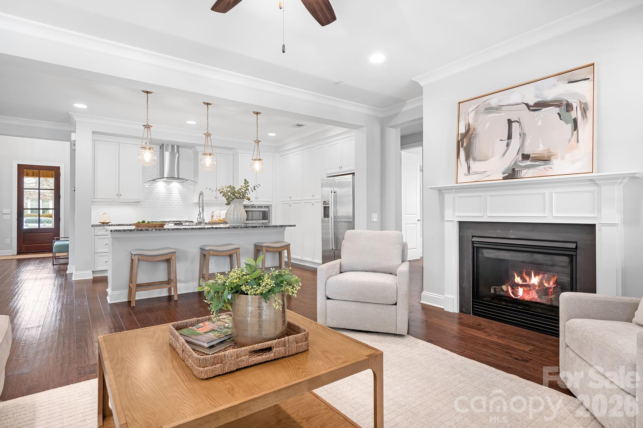 9121 Robbins Preserve Road Cornelius, NC 28031 - Photo 14 of 47 a living room with furniture and a fireplace