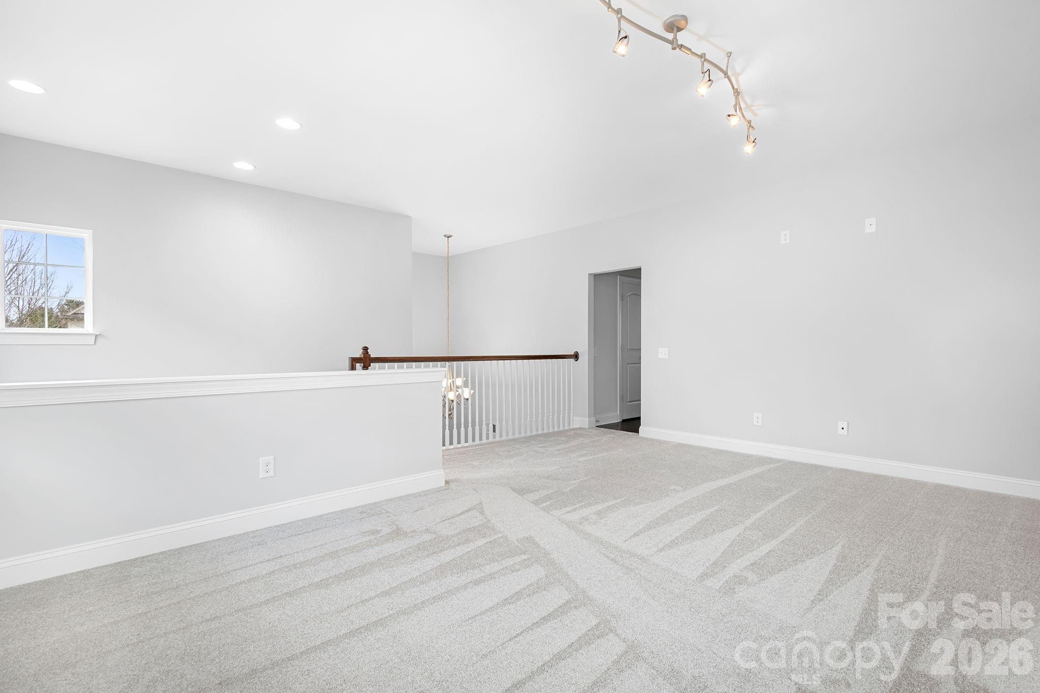 9121 Robbins Preserve Road Cornelius, NC 28031 - Photo 22 of 47 a view of a livingroom with kitchen and furniture