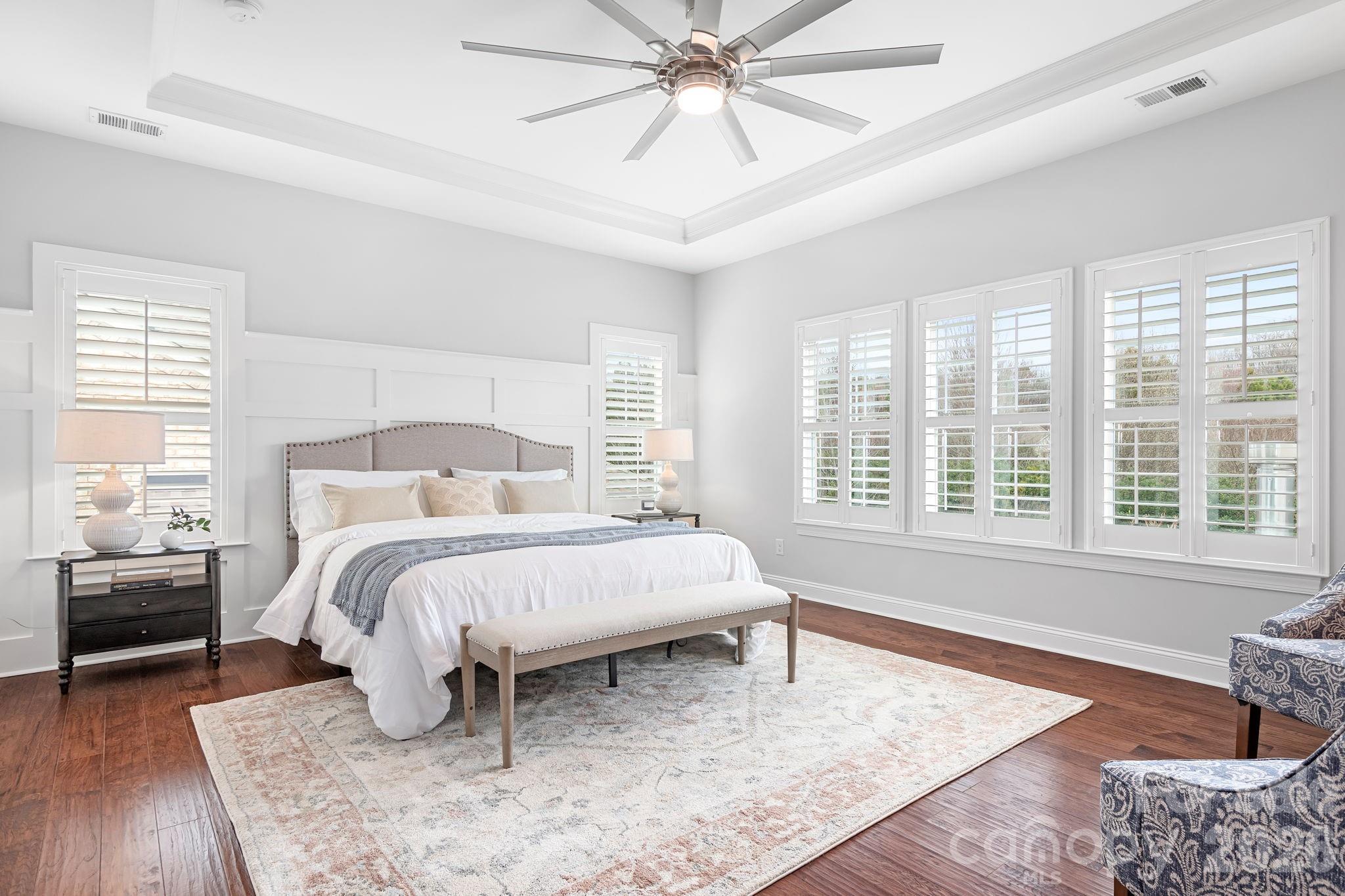 9121 Robbins Preserve Road Cornelius, NC 28031 - Photo 24 of 47 a bedroom with a bed and wooden floor