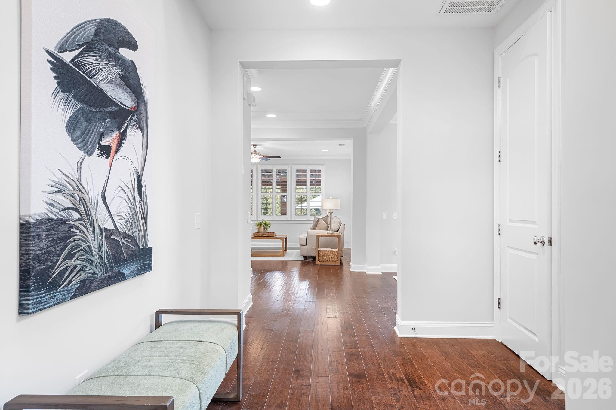 9121 Robbins Preserve Road Cornelius, NC 28031 - Photo 4 of 47 a living room with furniture and a wooden floor