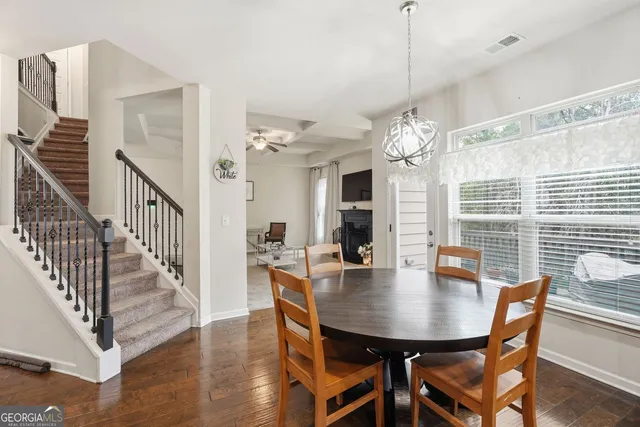 a view of a dining room with furniture window and wooden floor