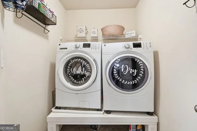 a utility room with dryer and washer