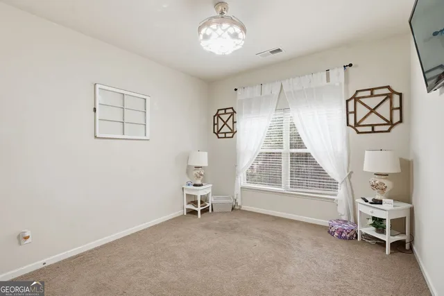 wooden floor with windows and white walls
